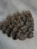 Natural brunette 9” curly
